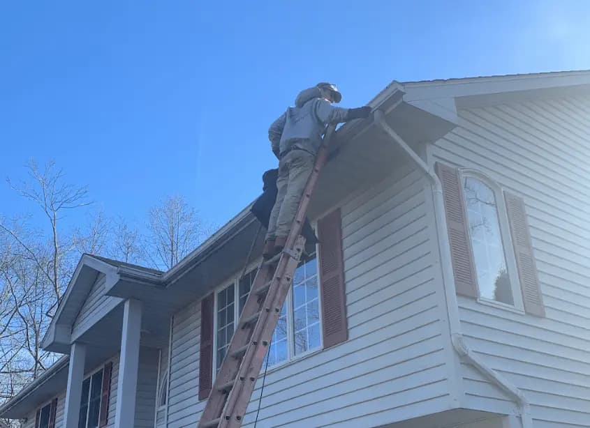 Gutter cleaning and maintenance being performed by Medina Power Washing in Medina