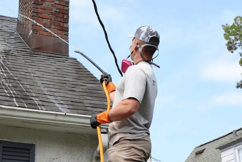 Medina Power Washing professional performing gentle roof washing service in Medina